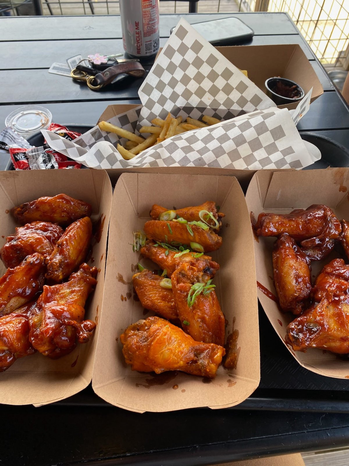 Saucy chicken wings and fries at Gordingo's